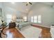Spacious primary bedroom featuring a high ceiling, large windows, and hardwood floors at 165 Blue Ridge Trl, Mooresville, NC 28117