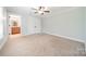 Bedroom with neutral carpet, double closet, and connected bathroom at 165 Blue Ridge Trl, Mooresville, NC 28117