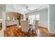 Elegant dining room with hardwood floors, and view to the living room creating an inviting atmosphere for meals at 165 Blue Ridge Trl, Mooresville, NC 28117