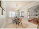 Elegant dining room featuring natural light, modern chandelier, and stylish table setting at 165 Blue Ridge Trl, Mooresville, NC 28117