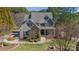 Well-maintained two-story home featuring manicured lawn and walkway leading to the front door at 165 Blue Ridge Trl, Mooresville, NC 28117
