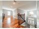 Upstairs hallway with a view of the foyer featuring a chandelier and a white door at 165 Blue Ridge Trl, Mooresville, NC 28117