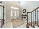 Grand foyer featuring tile floors, high ceilings, and an elegant staircase creating a welcoming entrance to the home at 165 Blue Ridge Trl, Mooresville, NC 28117