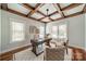 Cozy home office featuring a decorative ceiling, large windows, and hardwood floors for a professional workspace at home at 165 Blue Ridge Trl, Mooresville, NC 28117