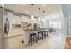 Modern kitchen with a large island, pendant lighting, stainless steel appliances and open concept dining area at 165 Blue Ridge Trl, Mooresville, NC 28117