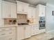 Well-appointed kitchen with white cabinetry, modern appliances, and stylish backsplash at 165 Blue Ridge Trl, Mooresville, NC 28117