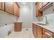 Well-organized laundry room with upper and lower cabinets and sink at 165 Blue Ridge Trl, Mooresville, NC 28117