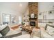 Cozy living room features a stone fireplace, custom built-ins, and ample natural light at 165 Blue Ridge Trl, Mooresville, NC 28117
