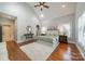 Spacious main bedroom featuring vaulted ceiling, hardwood floors, and calming neutral colors, creating a serene retreat at 165 Blue Ridge Trl, Mooresville, NC 28117