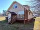 Exterior with back porch, showing deck stairs and a door leading to an outdoor space at 1806 Bringle Ferry Rd, Salisbury, NC 28146