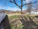 Backyard with a white fence, showcasing the spacious outdoor area at 1806 Bringle Ferry Rd, Salisbury, NC 28146