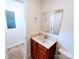 Functional bathroom featuring a vanity with storage and a mirror, offering practicality and comfort at 1806 Bringle Ferry Rd, Salisbury, NC 28146
