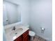 Clean bathroom with a sink, toilet, and a large mirror, providing essential amenities at 1806 Bringle Ferry Rd, Salisbury, NC 28146