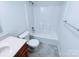 Bathroom featuring a toilet, vanity with a sink, and shower and tub combination at 1806 Bringle Ferry Rd, Salisbury, NC 28146