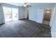Large bedroom with sliding glass doors to a deck and a ceiling fan, offering relaxation and outdoor access at 1806 Bringle Ferry Rd, Salisbury, NC 28146