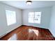 Bedroom featuring hardwood floors and a view of the front exterior at 1806 Bringle Ferry Rd, Salisbury, NC 28146