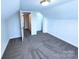 Bedroom featuring neutral walls and carpet, doorways to other rooms and a closet at 1806 Bringle Ferry Rd, Salisbury, NC 28146