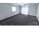Spacious bedroom with a ceiling fan and ample natural light, creating a comfortable retreat at 1806 Bringle Ferry Rd, Salisbury, NC 28146