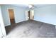 Bright and airy bedroom featuring a large carpeted area and closet, ideal for comfortable living at 1806 Bringle Ferry Rd, Salisbury, NC 28146