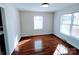 Bedroom featuring hardwood floors, neutral paint and a view of the front exterior at 1806 Bringle Ferry Rd, Salisbury, NC 28146