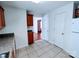 This kitchen features wood cabinets, white appliances, and a doorway to other rooms at 1806 Bringle Ferry Rd, Salisbury, NC 28146