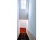 Staircase going downstairs featuring carpet and a wooden handrail at 1806 Bringle Ferry Rd, Salisbury, NC 28146
