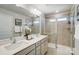 Modern bathroom featuring dual sinks, a large mirror, and a walk-in shower with glass doors at 2310 Hedgecliff Rd # 159, Kannapolis, NC 28025