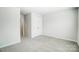 Clean, minimalist bedroom with plush carpet, double door closet, and neutral color palette at 2310 Hedgecliff Rd # 159, Kannapolis, NC 28025