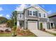 Charming two-story townhome with a one-car garage and manicured front yard landscaping at 2310 Hedgecliff Rd # 159, Kannapolis, NC 28025