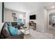 Inviting living room with comfortable seating, a sleek workspace, and soft natural light at 2310 Hedgecliff Rd # 159, Kannapolis, NC 28025
