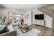 Cozy living room showcasing wood floors, a comfortable couch and a view of the staircase at 2310 Hedgecliff Rd # 159, Kannapolis, NC 28025