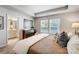 Bright bedroom with large windows, a dresser, and a doorway leading to the ensuite bathroom at 2310 Hedgecliff Rd # 159, Kannapolis, NC 28025