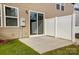 This cozy back patio features sliding glass doors, a white privacy fence, and easy access to the yard at 2320 Hedgecliff Rd # 158, Kannapolis, NC 28025