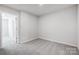 Bright bedroom featuring neutral walls, plush carpet, and an open doorway at 2320 Hedgecliff Rd # 158, Kannapolis, NC 28025