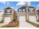 Charming townhome featuring a well-maintained lawn, attached garages, and classic design at 2320 Hedgecliff Rd # 158, Kannapolis, NC 28025