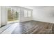 Bright living room featuring hardwood floors, sliding glass doors to the backyard, and neutral walls at 2320 Hedgecliff Rd # 158, Kannapolis, NC 28025