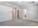 Spacious primary bedroom features neutral paint, carpet floors, a tray ceiling, and ensuite bathroom at 2330 Hedgecliff Rd # 157, Kannapolis, NC 28025
