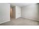 Bedroom with neutral paint, carpet floors, and closet at 2330 Hedgecliff Rd # 157, Kannapolis, NC 28025