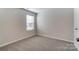 Bedroom with neutral paint, carpet floors, and a window at 2330 Hedgecliff Rd # 157, Kannapolis, NC 28025