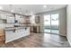 A spacious kitchen with stainless steel appliances, granite counters, and a breakfast bar overlooking the backyard at 2330 Hedgecliff Rd # 157, Kannapolis, NC 28025