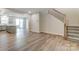 Open-concept living room with wood flooring and stairs to the upper level at 2330 Hedgecliff Rd # 157, Kannapolis, NC 28025