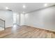 Bright and open living room with hardwood floors and easy access to the front entryway at 2330 Hedgecliff Rd # 157, Kannapolis, NC 28025