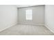 This bedroom features neutral walls, carpet, a window, and electric outlets ready for your personal touch at 2340 Hedgecliff Rd # 156, Kannapolis, NC 28025