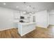Well-lit kitchen featuring pendant lights, stainless steel appliances, white cabinetry, and a pantry at 2340 Hedgecliff Rd # 156, Kannapolis, NC 28025