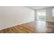 Bright living room boasts beautiful hardwood floors and sliding glass doors to a private patio at 2340 Hedgecliff Rd # 156, Kannapolis, NC 28025
