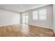 Bright living room featuring wood-look flooring, recessed lighting, and sliding glass door to the exterior at 2340 Hedgecliff Rd # 156, Kannapolis, NC 28025