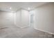 Open loft area with neutral carpet and recessed lighting at 2340 Hedgecliff Rd # 156, Kannapolis, NC 28025