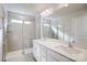 Bathroom featuring double sink vanity and glass enclosed shower with tiled walls at 2350 Hedgecliff Rd, Kannapolis, NC 28025