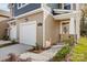 Close-up of a charming home featuring a stone-accented entryway and attached garage, landscaped for curb appeal at 2350 Hedgecliff Rd, Kannapolis, NC 28025