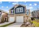Charming two-story townhome with attached garages, landscaped front yard, and inviting entryway at 2350 Hedgecliff Rd, Kannapolis, NC 28025